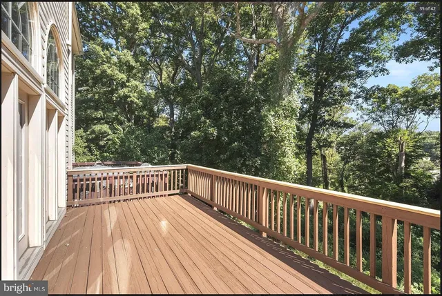 a view of balcony with wooden floor