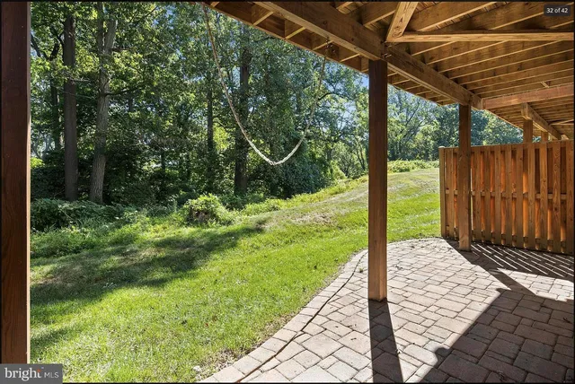 a view of a backyard with pathway