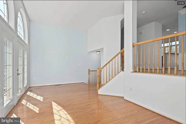 a view of an entryway with wooden floor