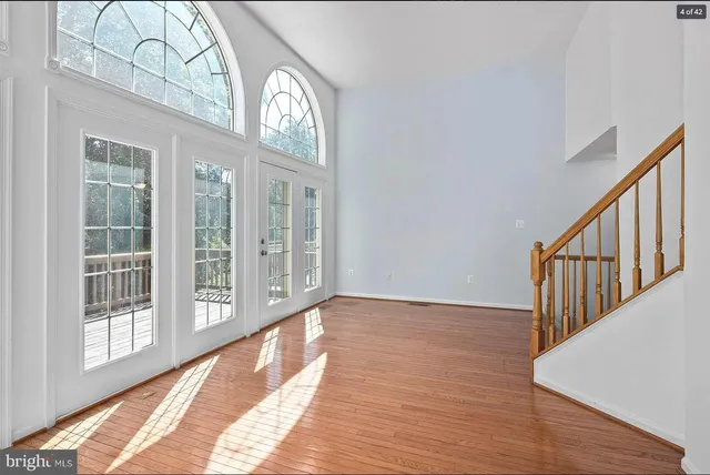 a view of an entryway with wooden floor