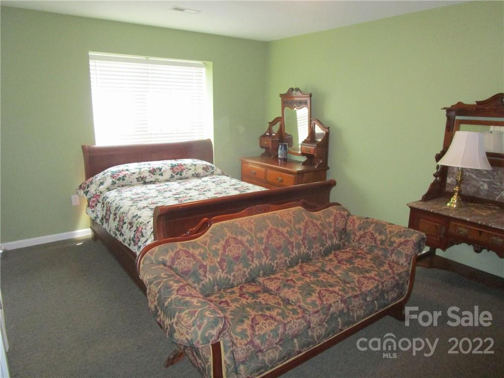 29 Aeronca Road Belton, SC 29627 - Photo 8 of 18 a bedroom with a bed and dresser