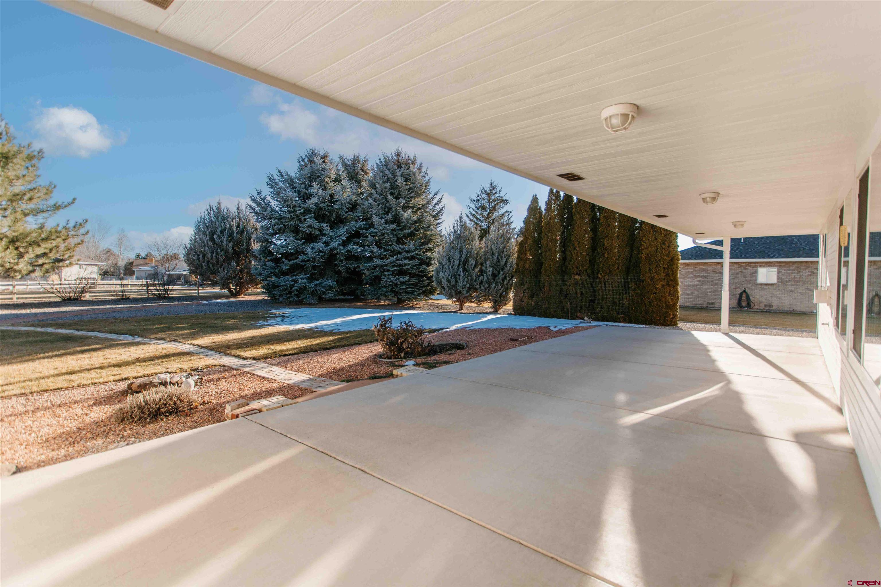2806 Bluebell Court Montrose, CO 81401 - Photo 22 of 37 a view of a swimming pool with an outdoor space and seating area