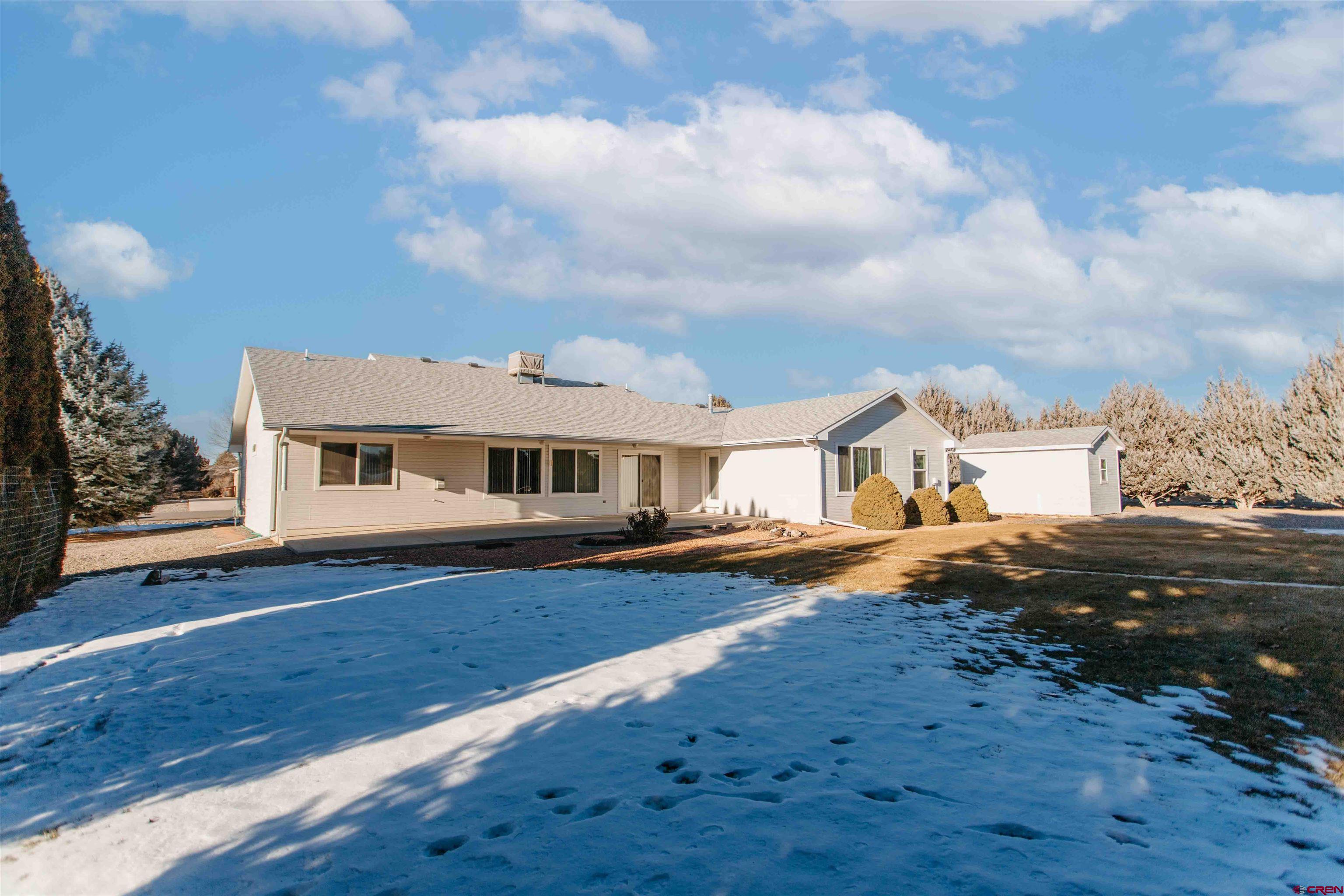 2806 Bluebell Court Montrose, CO 81401 - Photo 24 of 37 a front view of a house with a yard