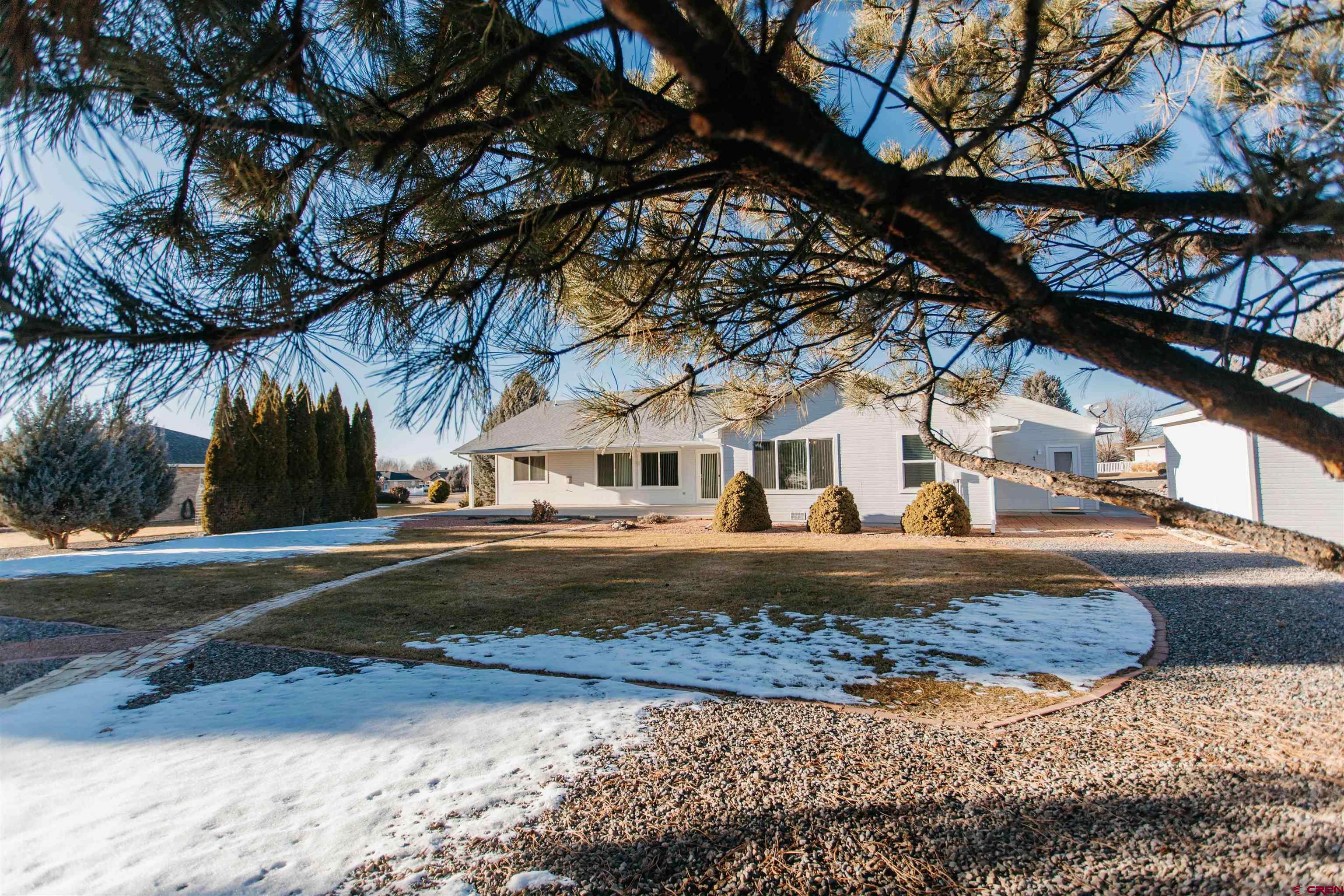 2806 Bluebell Court Montrose, CO 81401 - Photo 27 of 37 a front view of a house with a yard