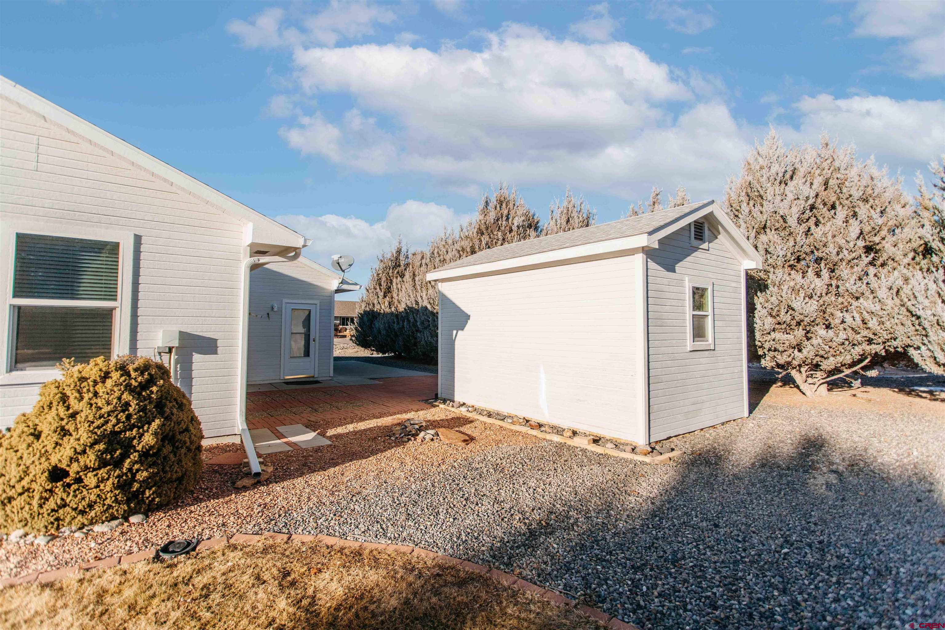 2806 Bluebell Court Montrose, CO 81401 - Photo 29 of 37 a view of a house with a backyard