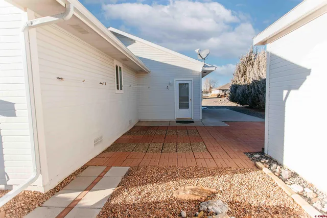 a view of a backyard of the house