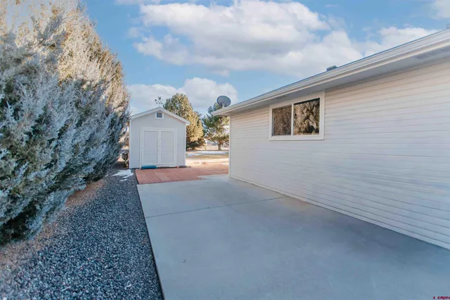 a view of a house with a yard and garage
