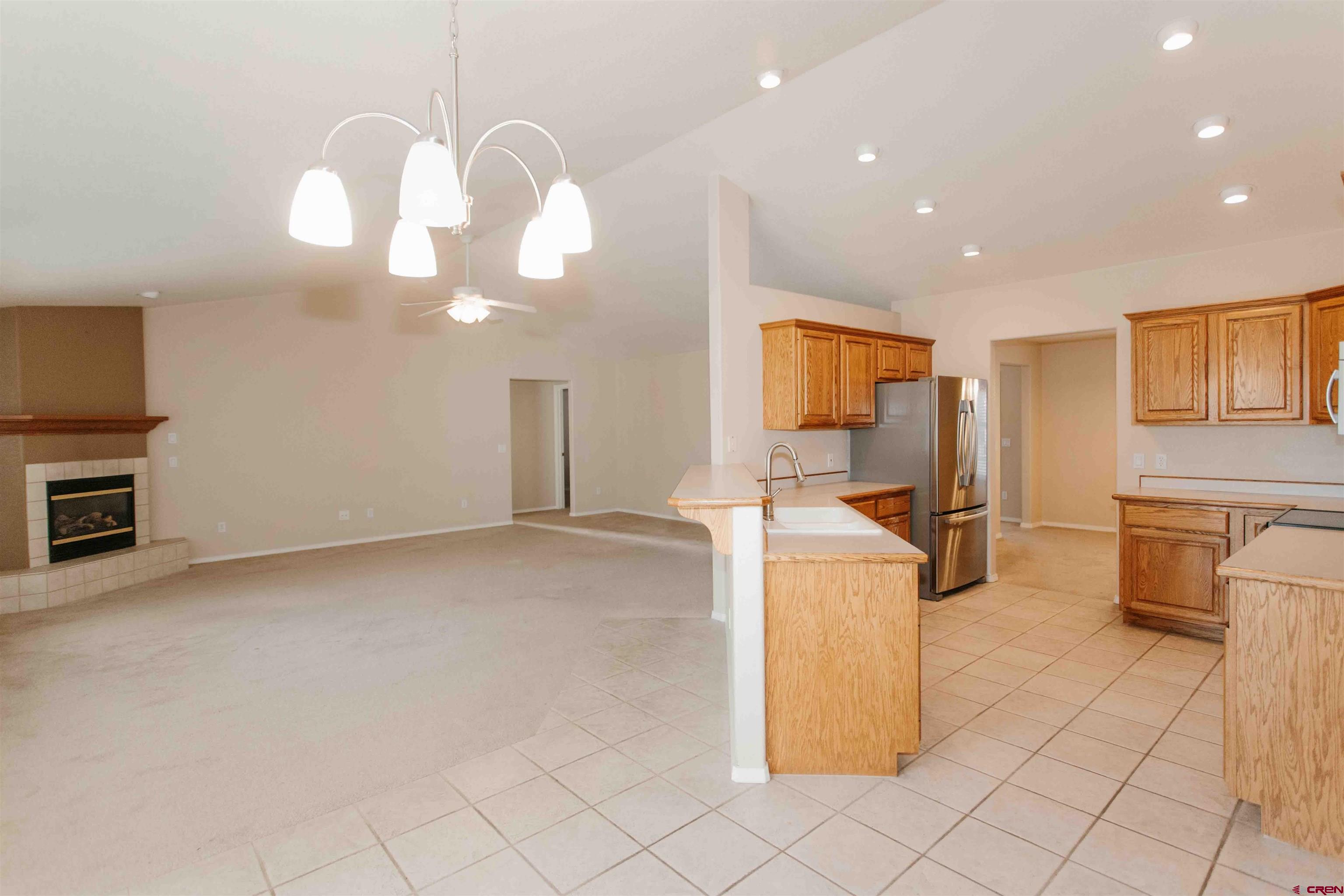 2806 Bluebell Court Montrose, CO 81401 - Photo 10 of 37 a view of a kitchen with furniture and a kitchen