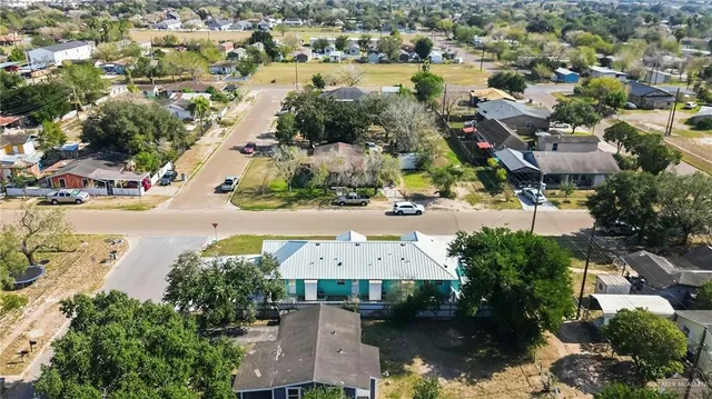 an aerial view of residential houses with lake view