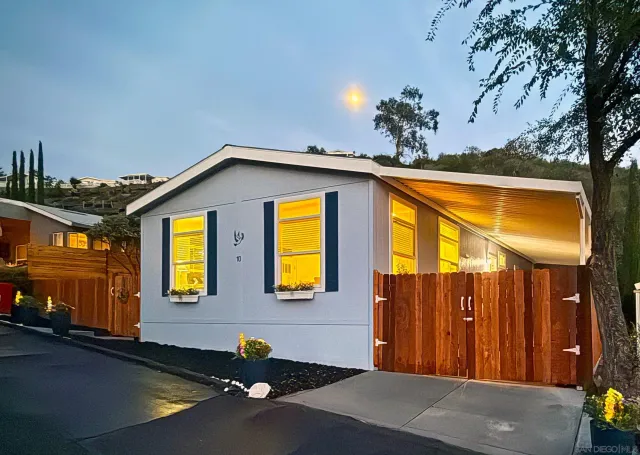 a front view of residential houses with yard
