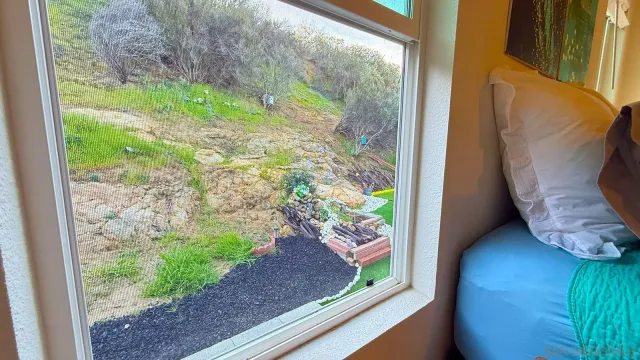 a bathroom with a double vanity sink mirror and shower
