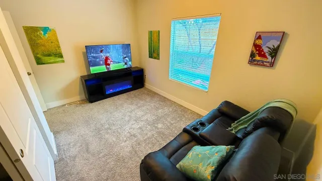 a view of a living room with furniture and a window