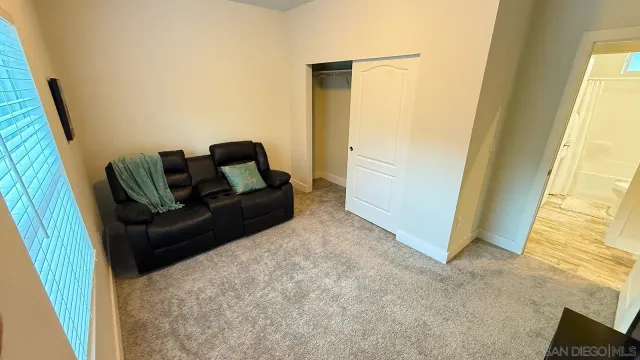 a bathroom with a toilet sink and shower