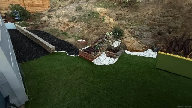 a view of a backyard with sitting area