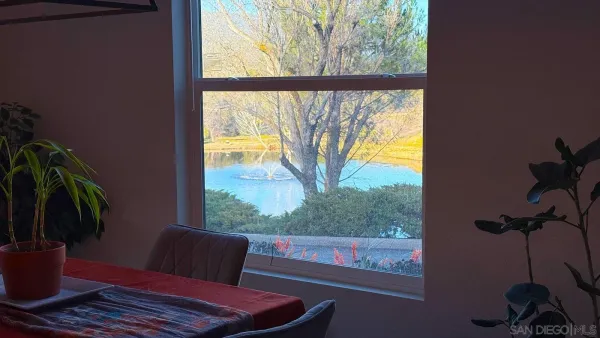 a living room with furniture wooden floor and a flat screen tv