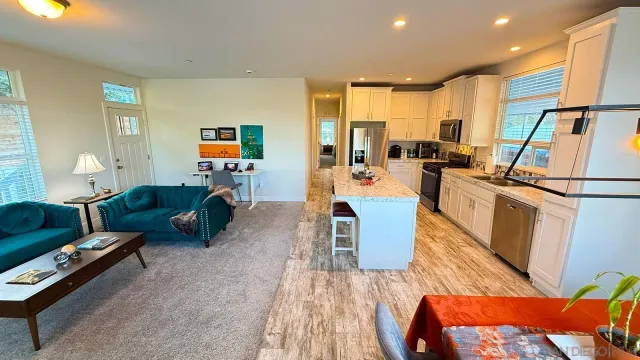 a bed sitting in a room next to a window