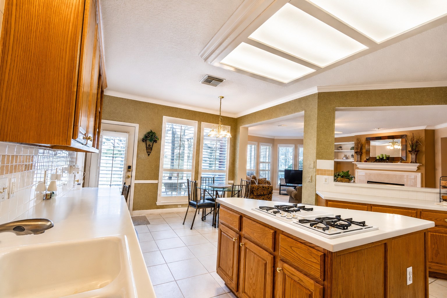 5718 Oakmoss Trail Spring, TX 77379 - Photo 12 of 47 Kitchen is bright and open to the breakfast area.