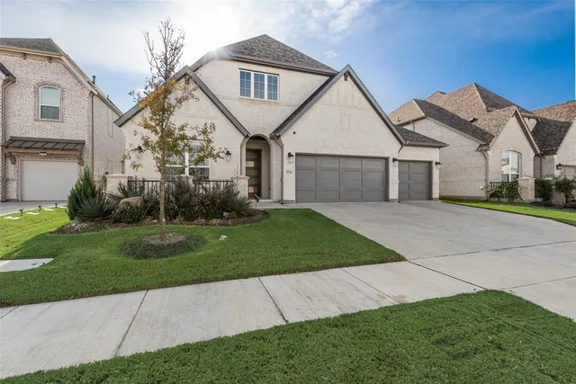 front view of a house with a yard