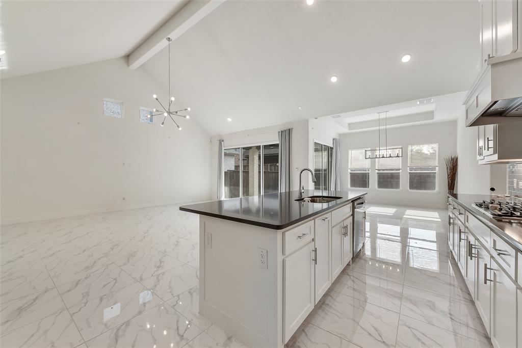 2714 Chambray Lane Mansfield, TX 76063 - Photo 15 of 32 a kitchen with stainless steel appliances granite countertop a sink and cabinets