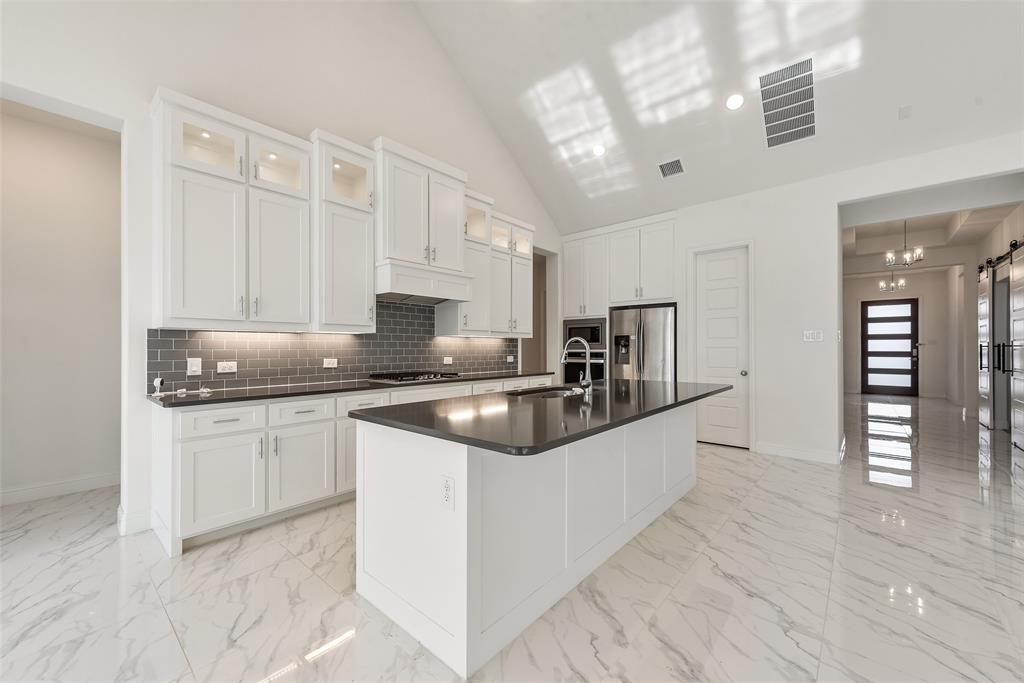 2714 Chambray Lane Mansfield, TX 76063 - Photo 18 of 32 a kitchen with granite countertop a sink and cabinets