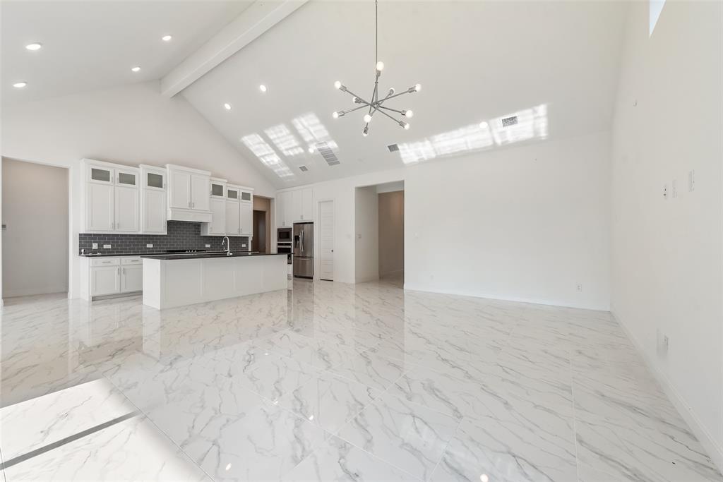 2714 Chambray Lane Mansfield, TX 76063 - Photo 19 of 32 a view of a kitchen with a sink and refrigerator