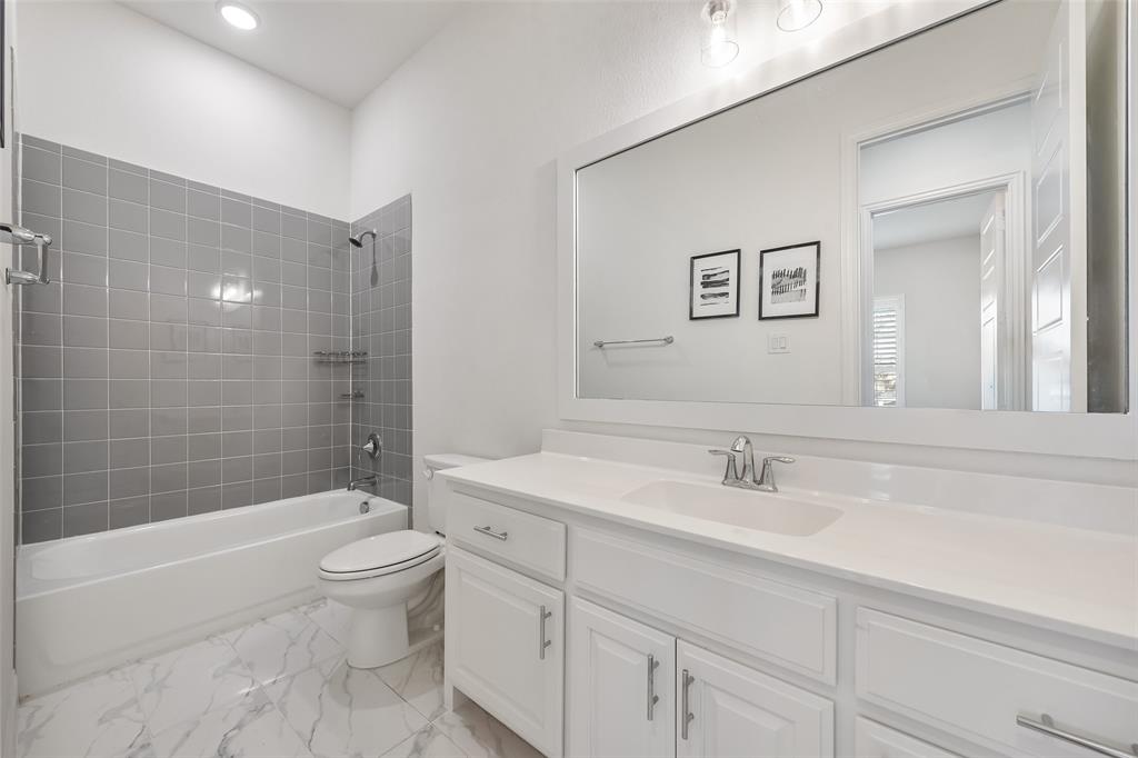 2714 Chambray Lane Mansfield, TX 76063 - Photo 20 of 32 a bathroom with a sink a toilet and shower
