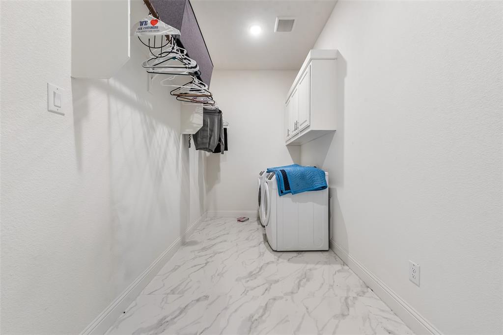 2714 Chambray Lane Mansfield, TX 76063 - Photo 23 of 32 a view of storage and utility room with washer and dryer