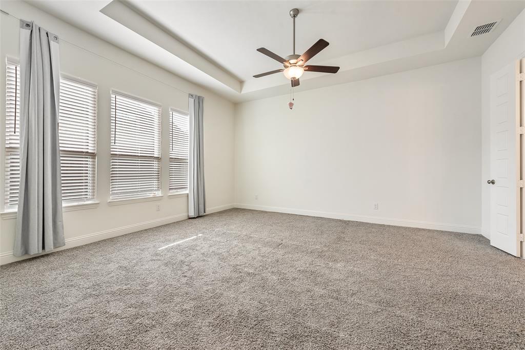 2714 Chambray Lane Mansfield, TX 76063 - Photo 26 of 32 an empty room with windows and fan