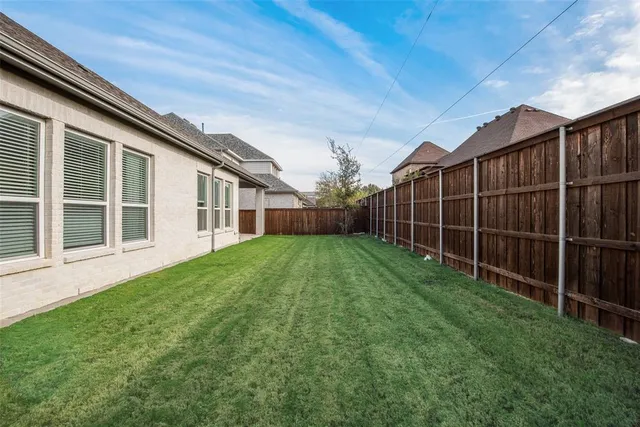a view of backyard with green space