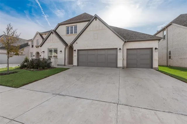 a front view of a house with garage