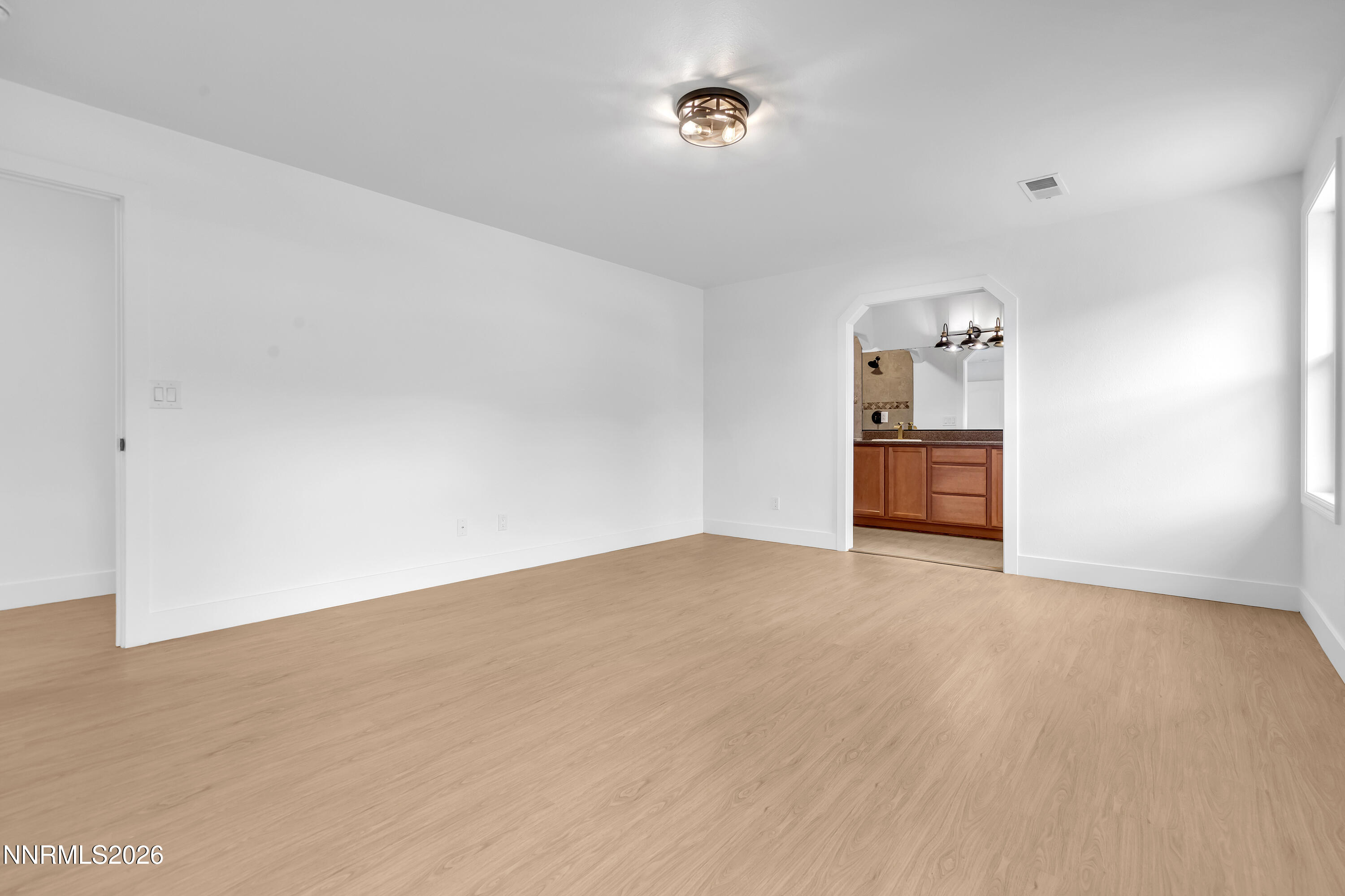 3825 Dyal Court Reno, NV 89508 - Photo 15 of 39 a view of empty room with wooden floor
