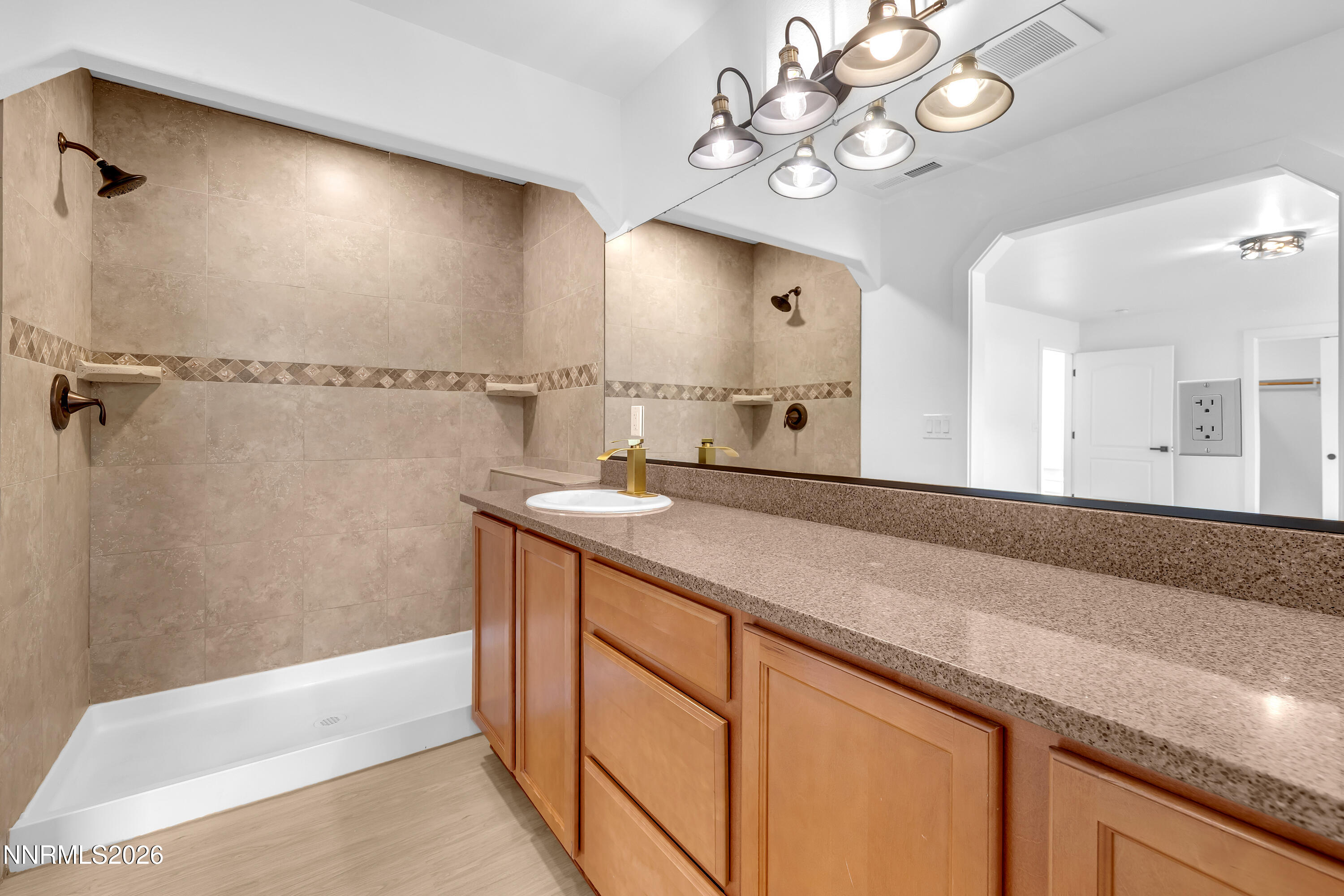 3825 Dyal Court Reno, NV 89508 - Photo 2 of 39 a spacious bathroom with a granite countertop sink a mirror and a bathtub
