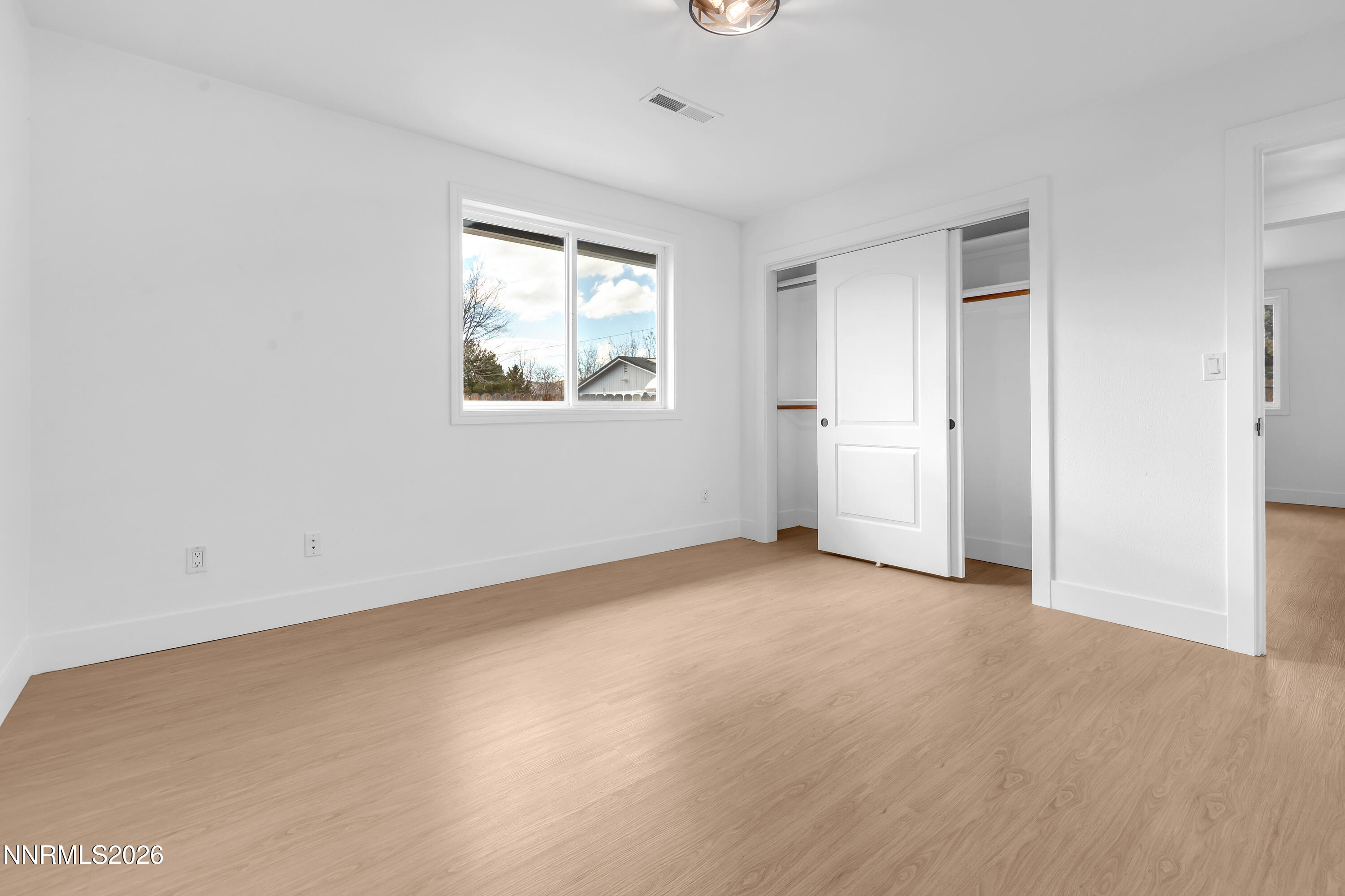 3825 Dyal Court Reno, NV 89508 - Photo 22 of 39 an empty room with windows and closet