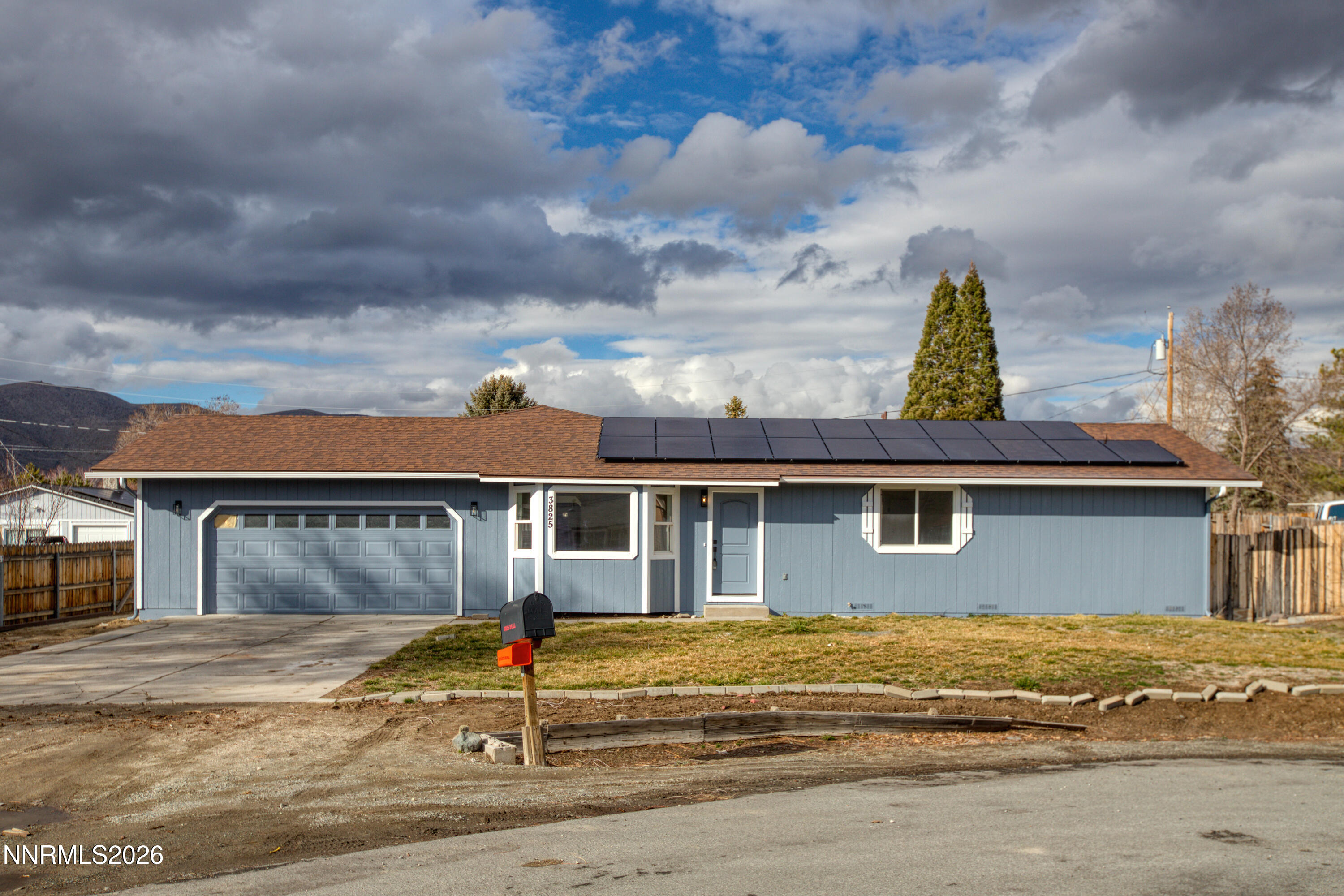 3825 Dyal Court Reno, NV 89508 - Photo 3 of 39 a view of a white house with a large space next to a road