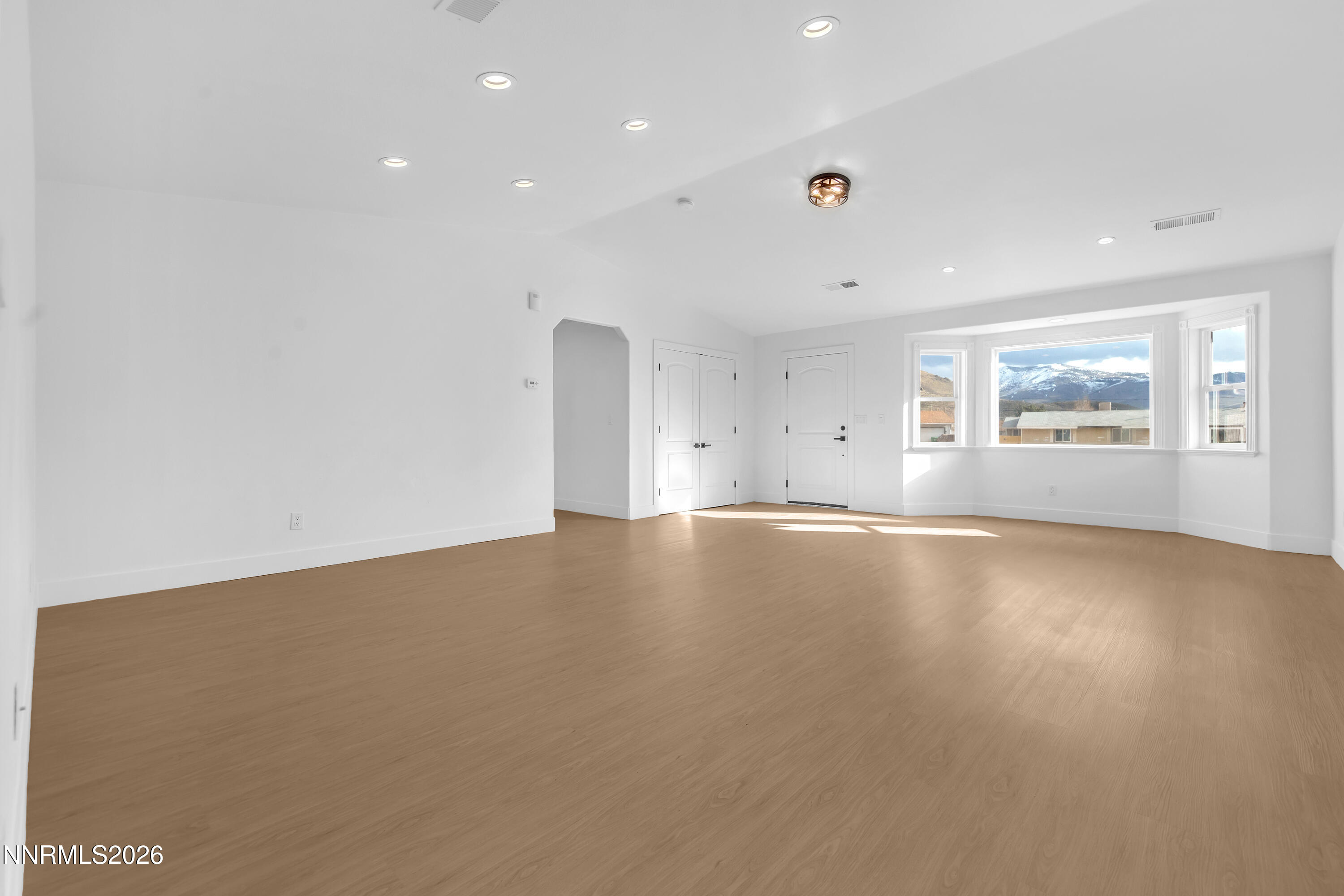 3825 Dyal Court Reno, NV 89508 - Photo 5 of 39 an empty room with wooden floor and windows