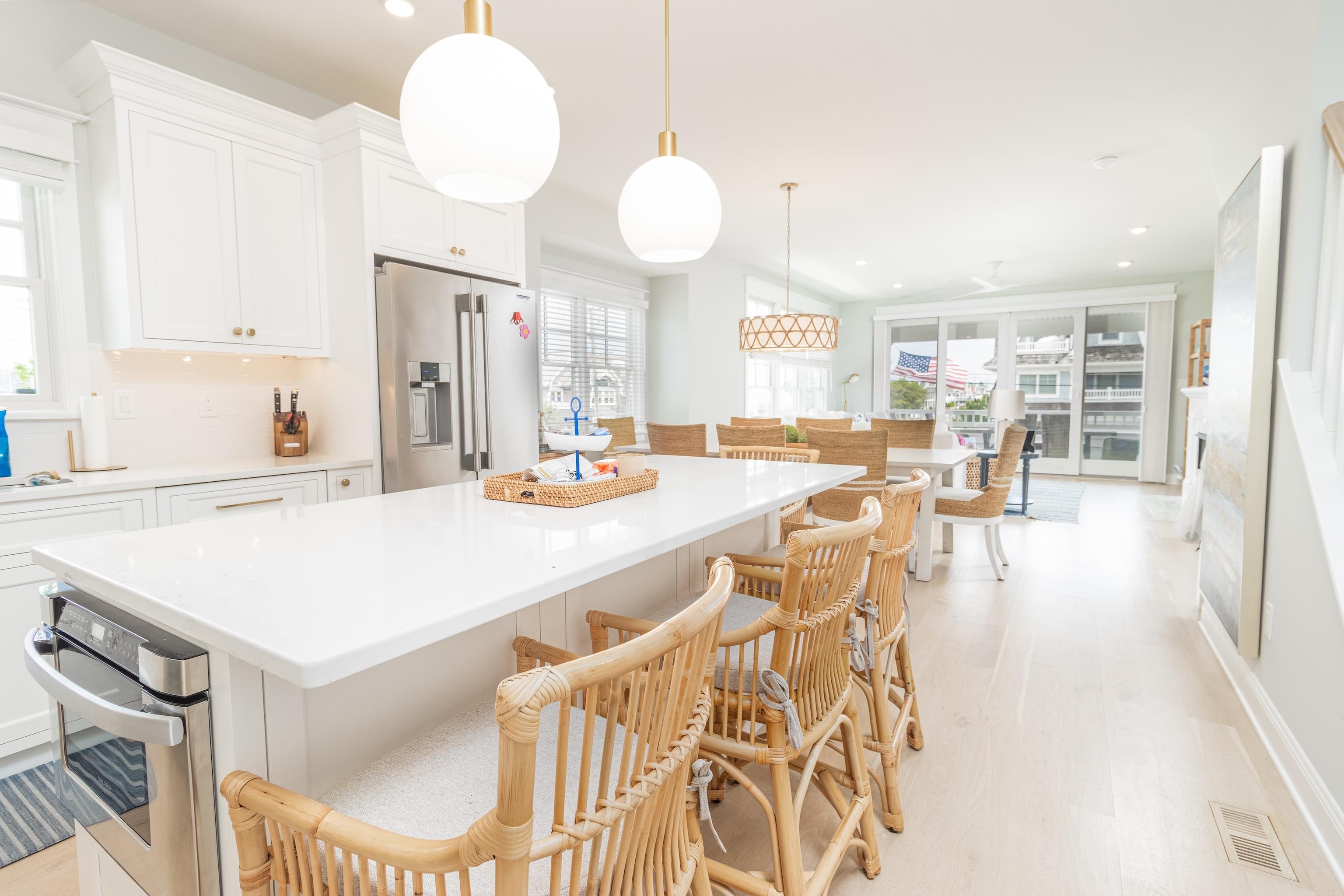 8 East 27th, Unit WEST Avalon, NJ 08202 - Photo 16 of 32 a large kitchen with a table and chairs