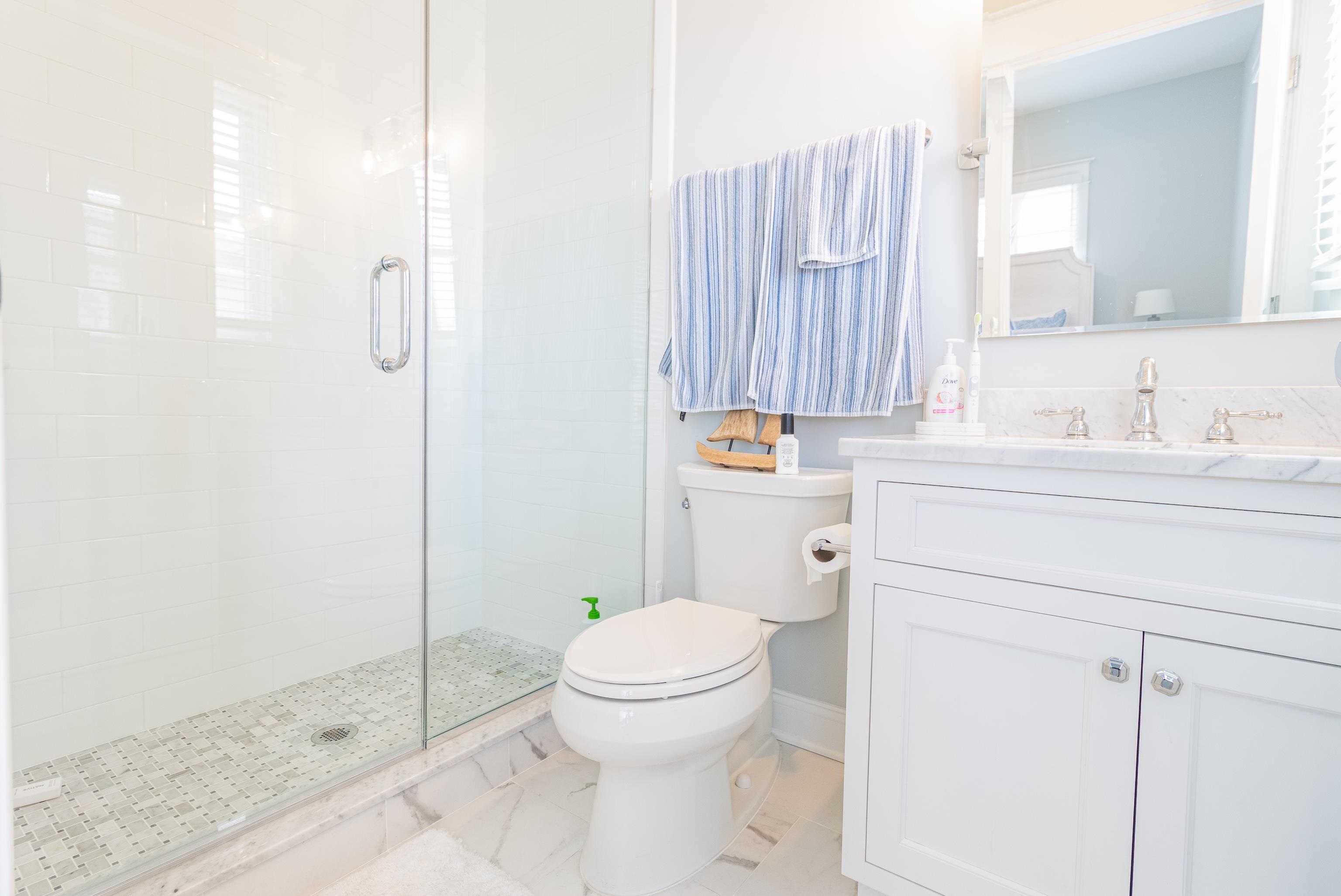 8 East 27th, Unit WEST Avalon, NJ 08202 - Photo 18 of 32 a bathroom with a sink a toilet and shower