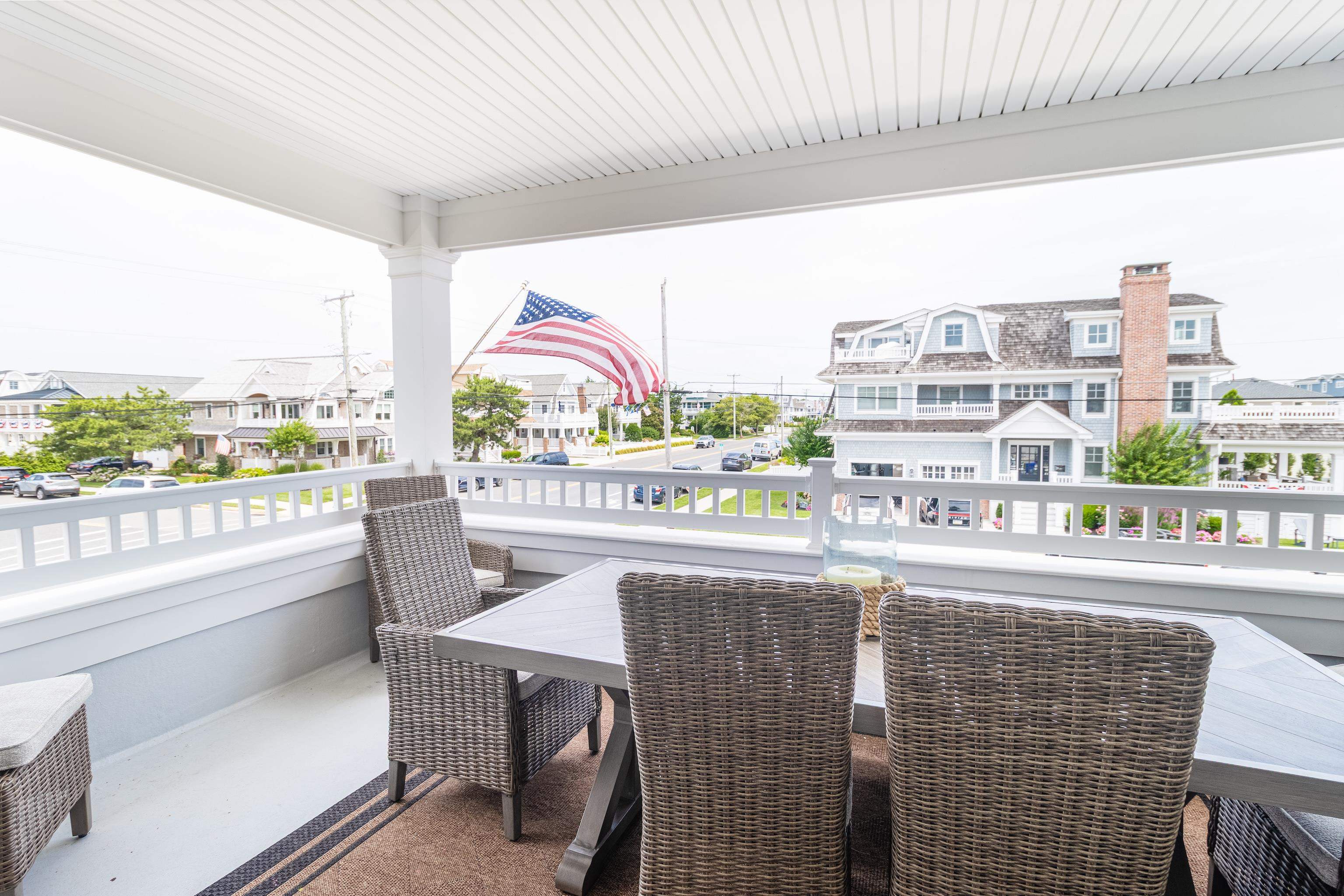 8 East 27th, Unit WEST Avalon, NJ 08202 - Photo 19 of 32 a living room with a couch and a floor to ceiling window