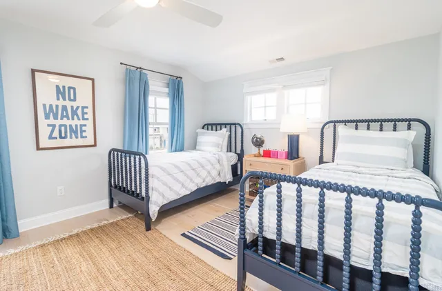 a bedroom with a bed and a night stand