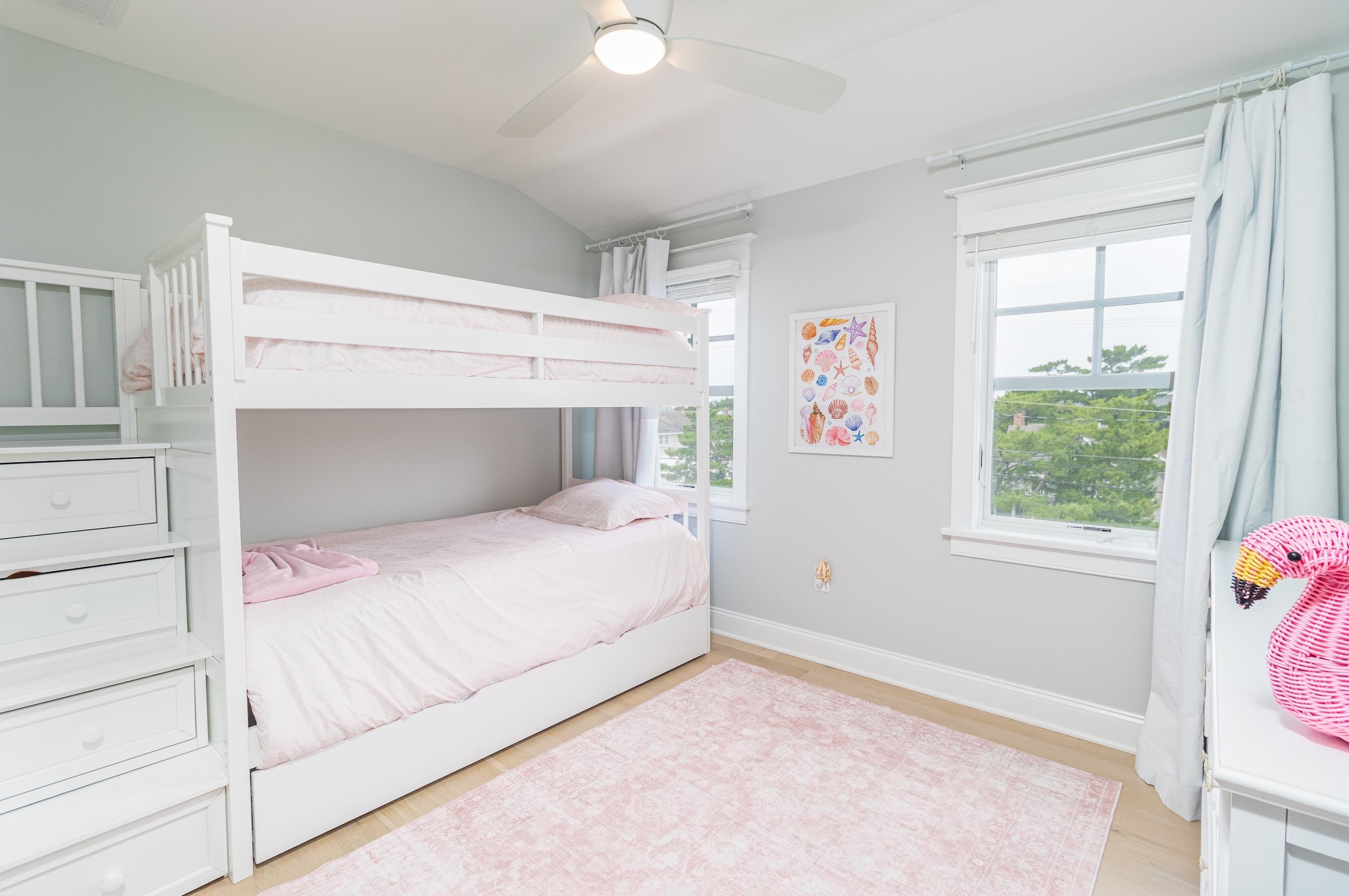 8 East 27th, Unit WEST Avalon, NJ 08202 - Photo 22 of 32 a bedroom with a bed and a window
