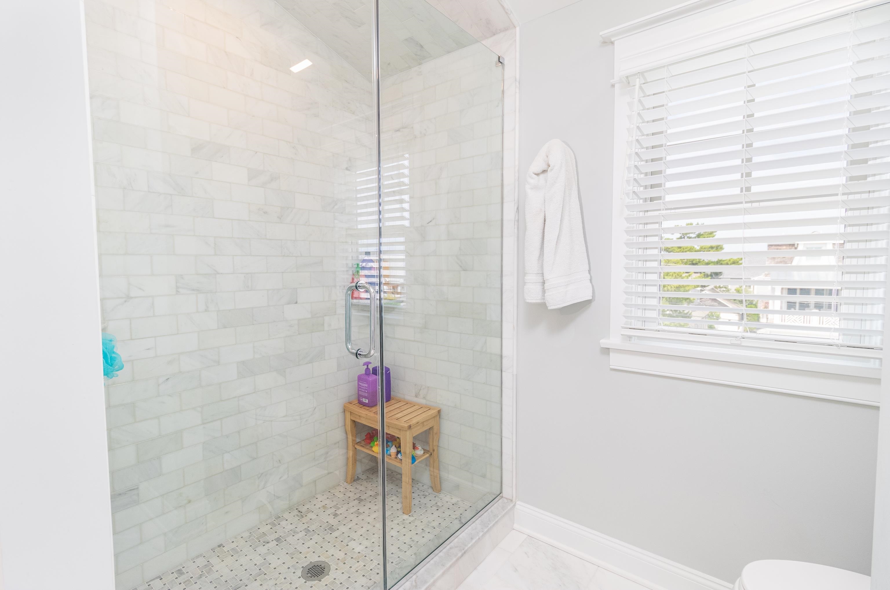 8 East 27th, Unit WEST Avalon, NJ 08202 - Photo 27 of 32 a bathroom with a shower and a sink