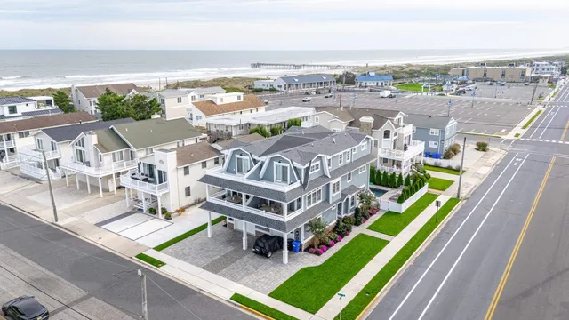 an aerial view of a house with a big yard and potted plants