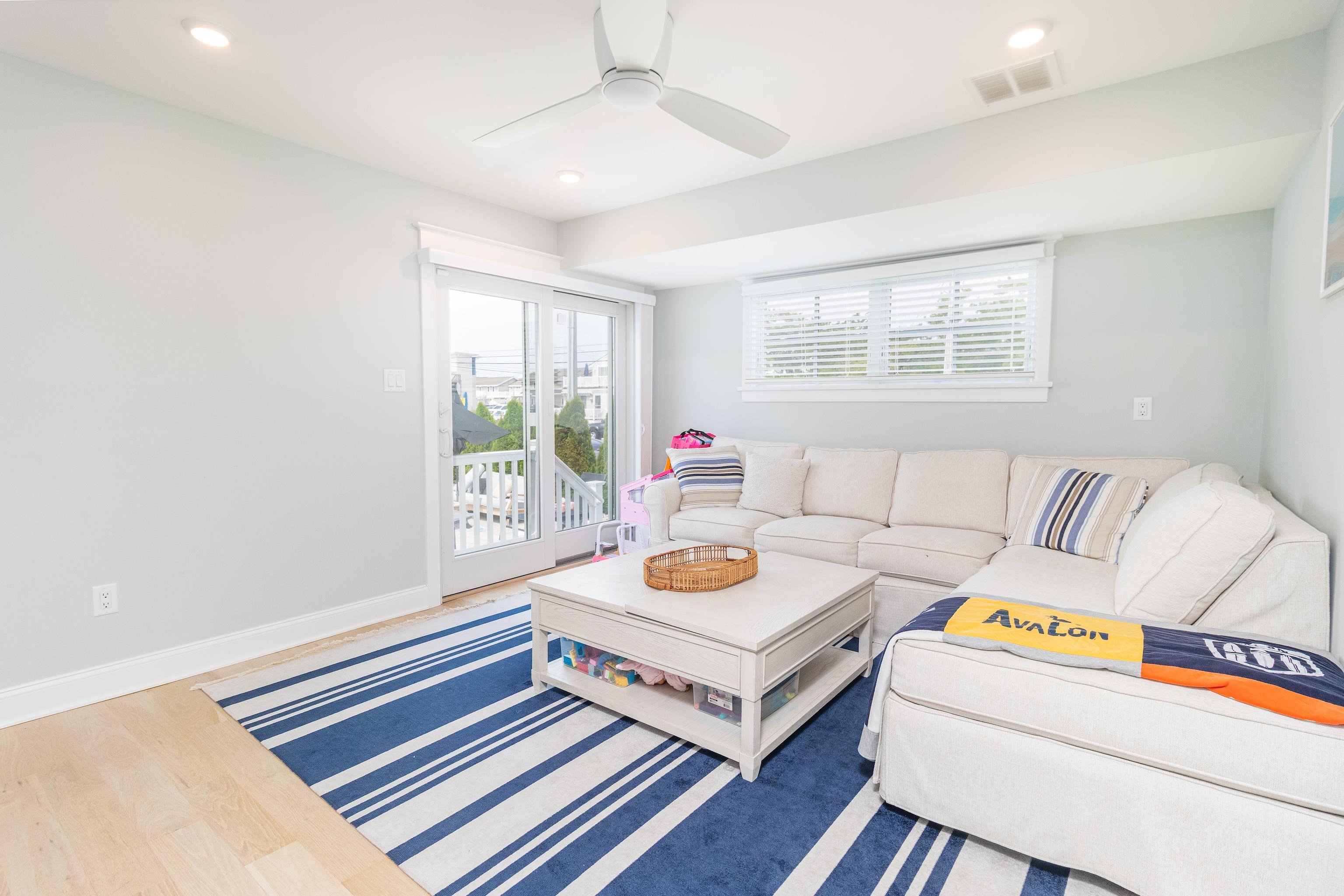 8 East 27th, Unit WEST Avalon, NJ 08202 - Photo 5 of 32 a living room with furniture and a window