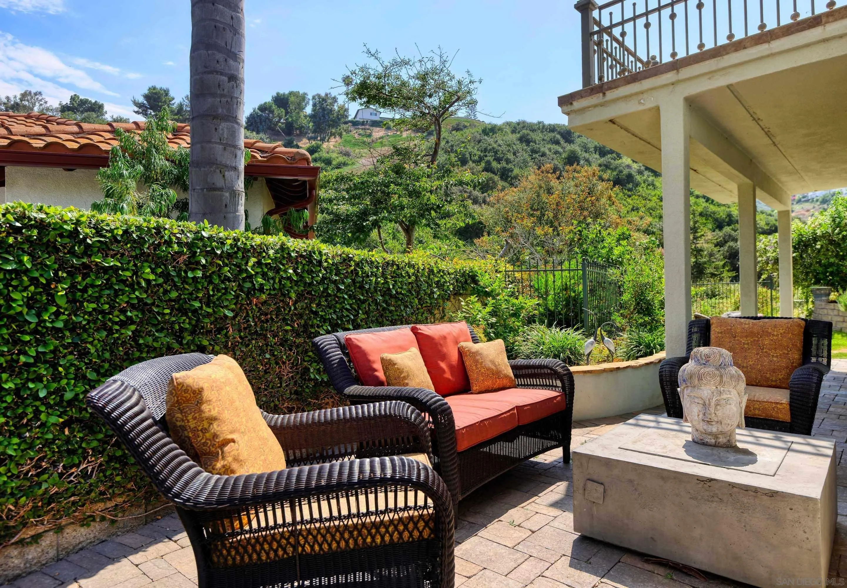 2795 Ridgegate Row La Jolla, CA 92037 - Photo 3 of 4 a view of a patio with couches chairs and a potted plant