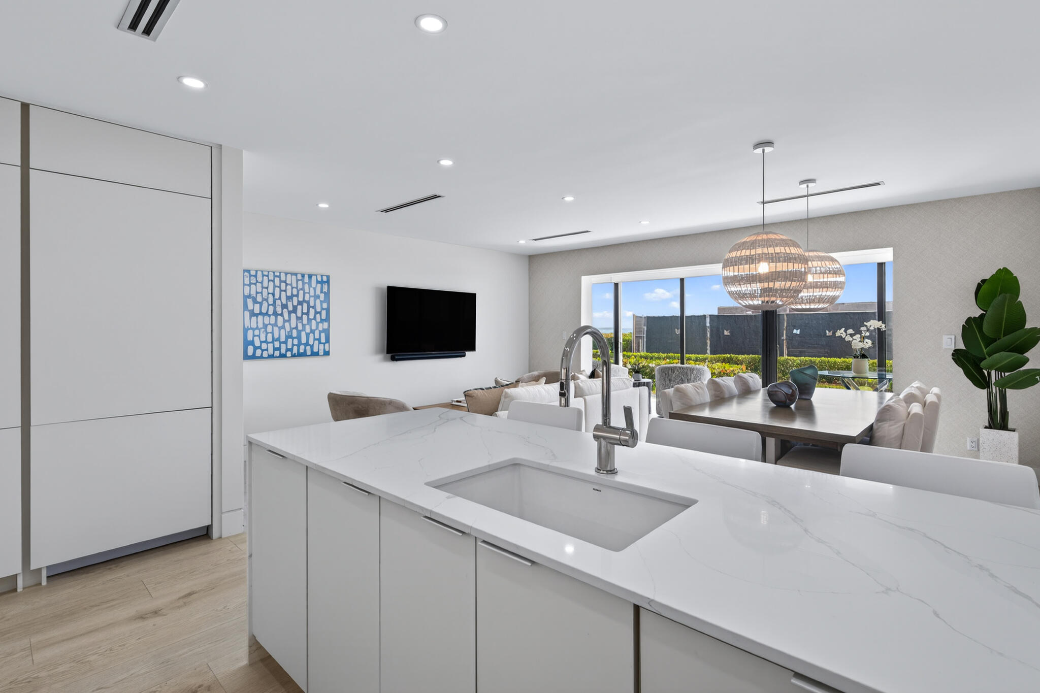 5720 Old Ocean Boulevard, Unit 5E Ocean Ridge, FL 33435 - Photo 11 of 29 a kitchen with a sink and a refrigerator