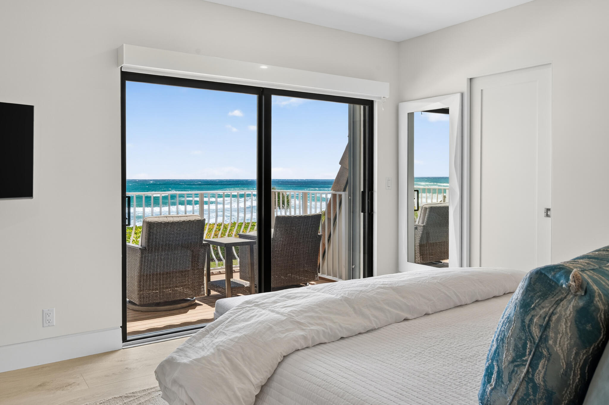5720 Old Ocean Boulevard, Unit 5E Ocean Ridge, FL 33435 - Photo 18 of 29 a bedroom with a bed and large window