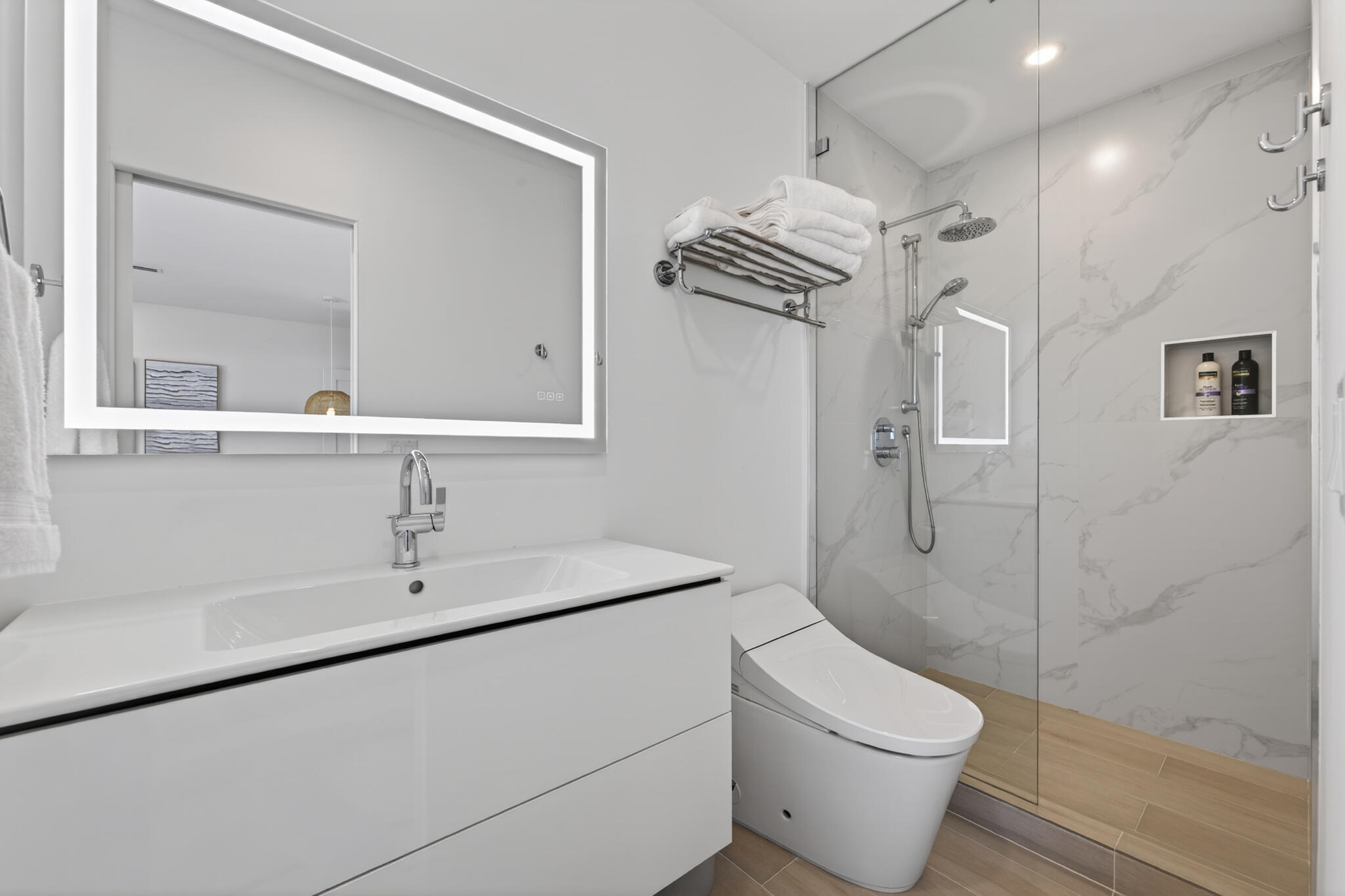 5720 Old Ocean Boulevard, Unit 5E Ocean Ridge, FL 33435 - Photo 20 of 29 a bathroom with a toilet sink and shower
