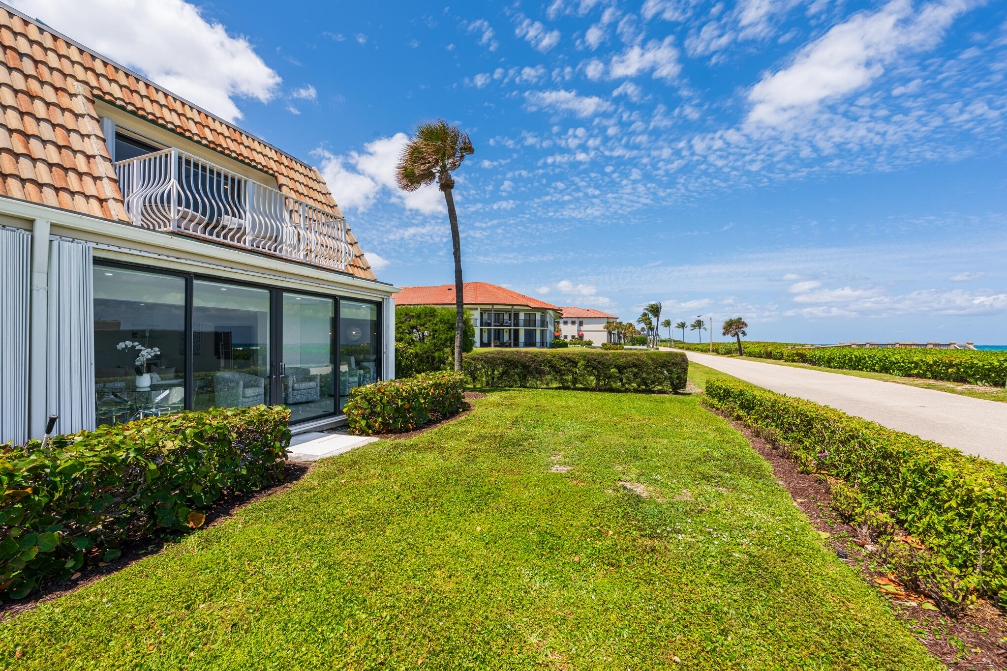 5720 Old Ocean Boulevard, Unit 5E Ocean Ridge, FL 33435 - Photo 29 of 29 a view of a house with a swimming pool