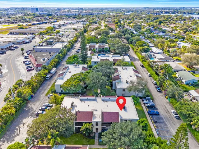 an aerial view of residential houses with outdoor space