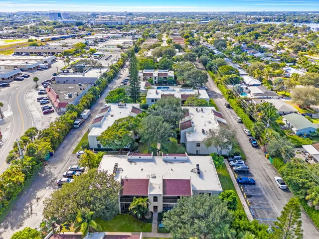 an aerial view of residential houses with outdoor space